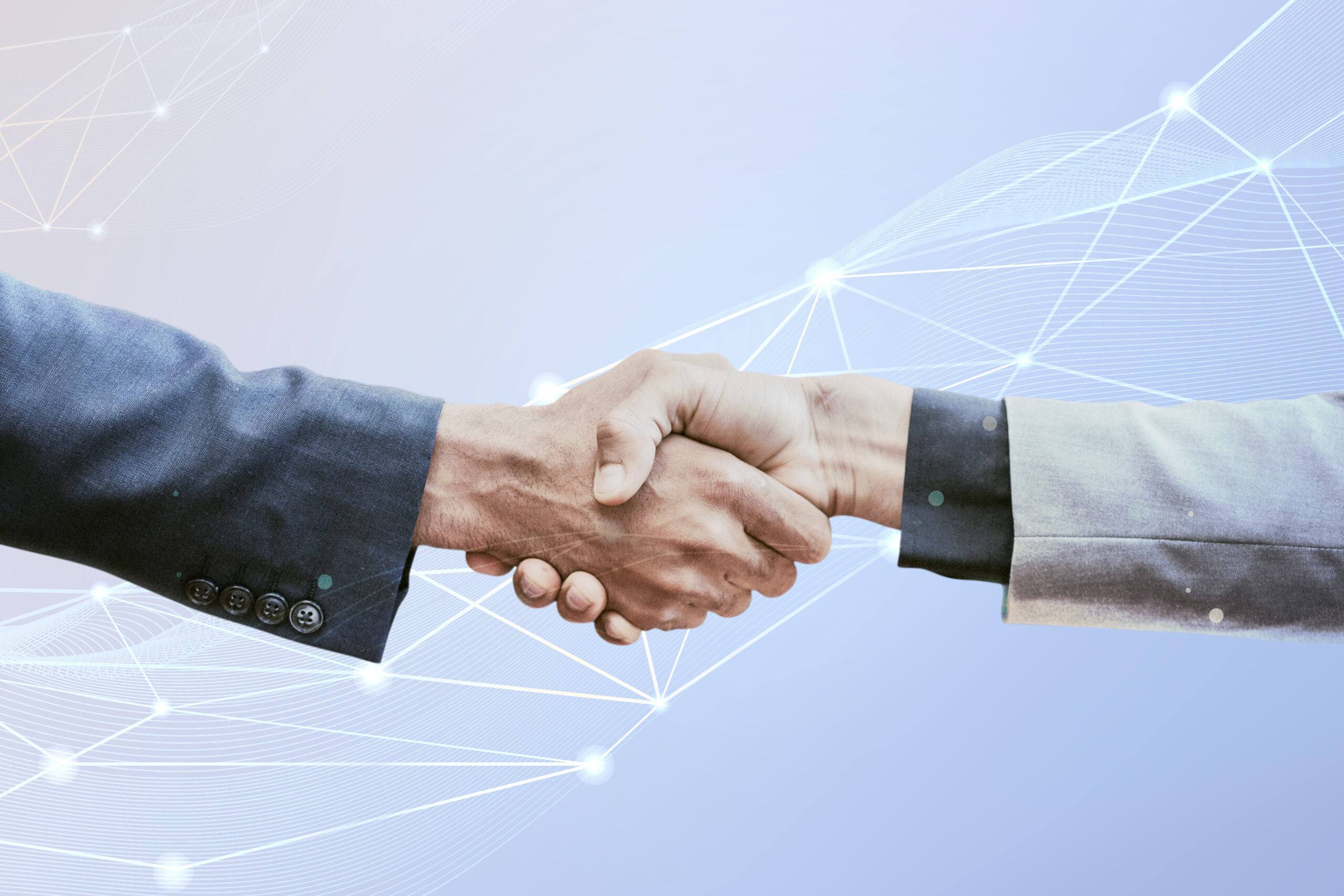 Business professionals shaking hands, representing automated lead nurturing, stronger customer relationships, and successful deal closures with Flavor CRM.
